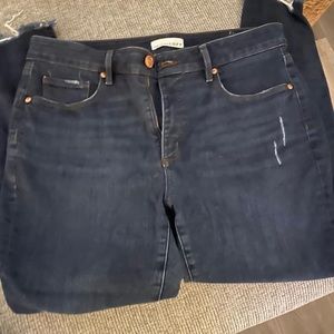 Distressed skinny dark wash jeans